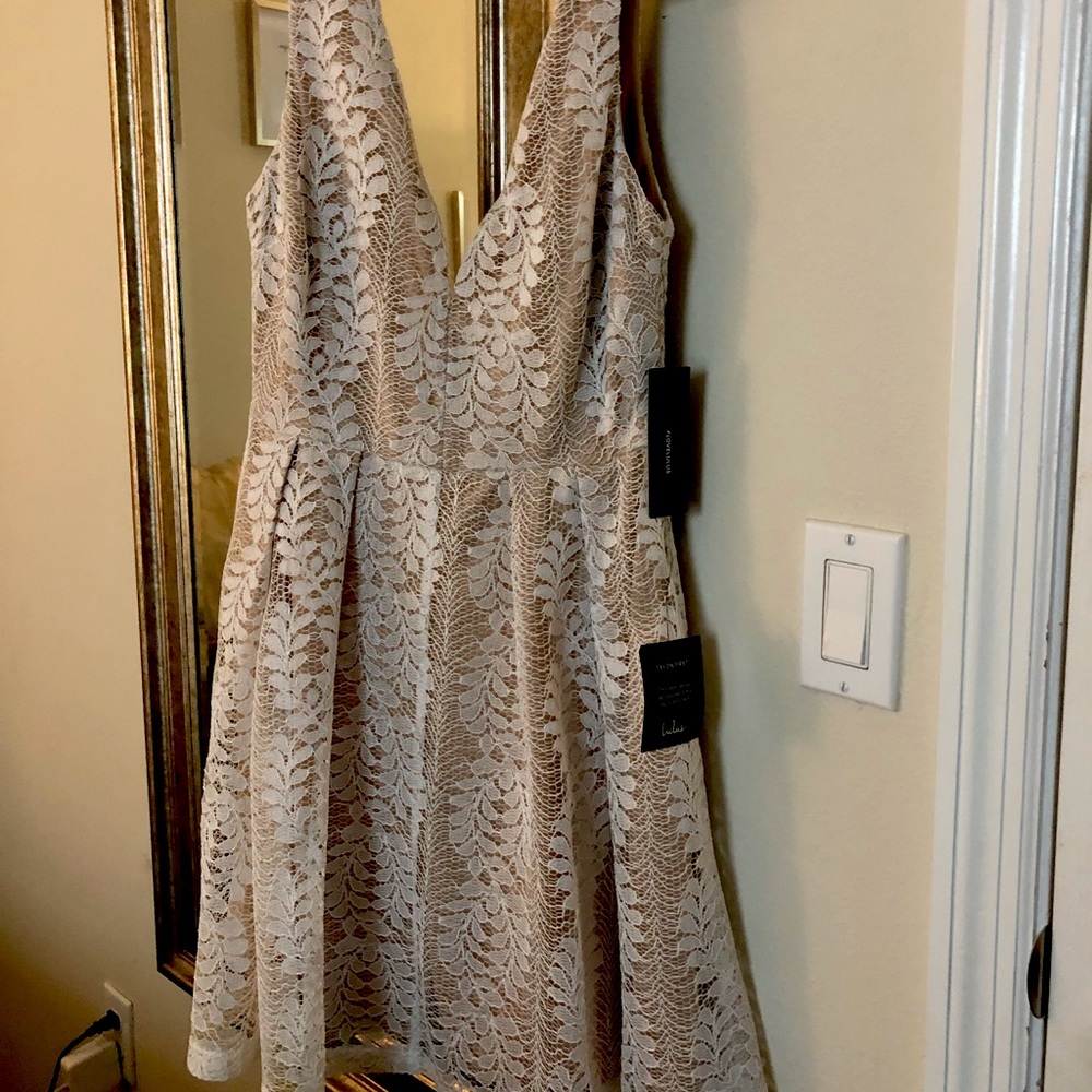Short, white and nude lace dress.